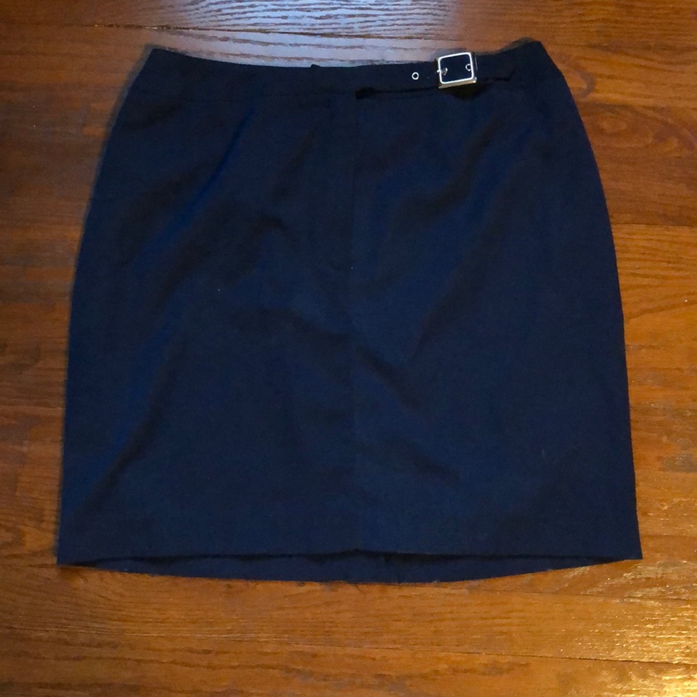 a navy blue skirt with sliver buckle. worn once.